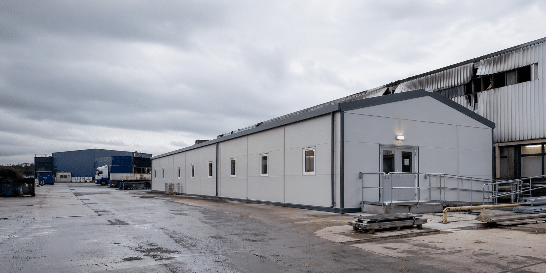 Temporary building installation time line. Temporary building on industrial site following fire or flood damage to restore operations