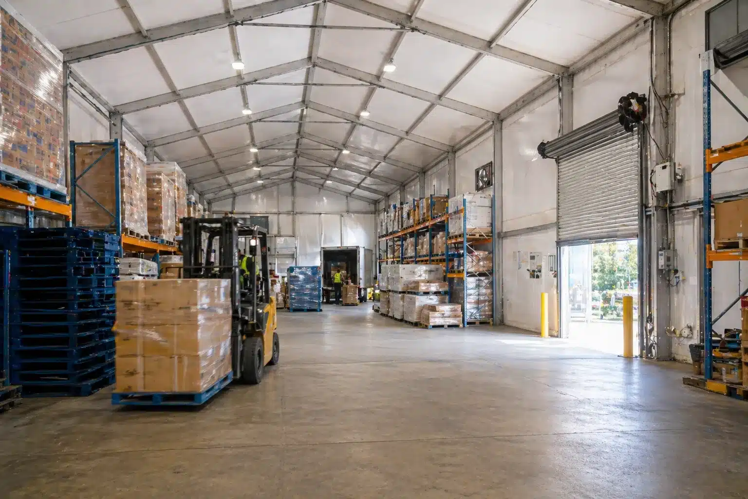 How Do Temporary Buildings Support Business Continuity. Inside a temporary warehouse building supporting live logistics and operational continuity